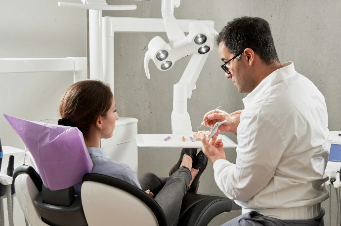 man in white dress shirt sitting on black office rolling chair